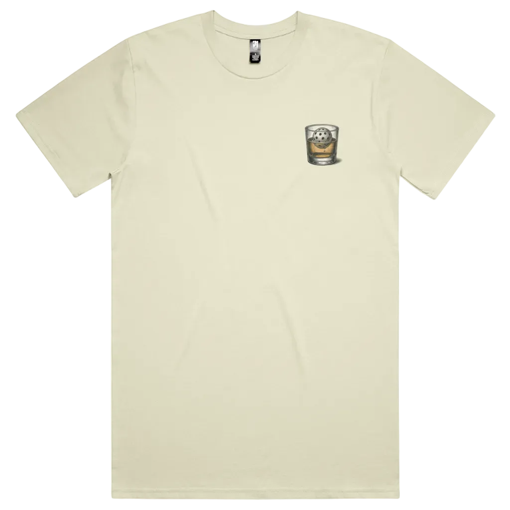 Front view of Neat Serve Pickleback Original tee in raw white with small left-chest graphic of a pickleball in a whisky glass